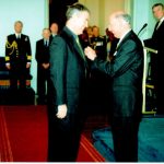 Ross Smith receives the Order of Australia Medal from the Governor